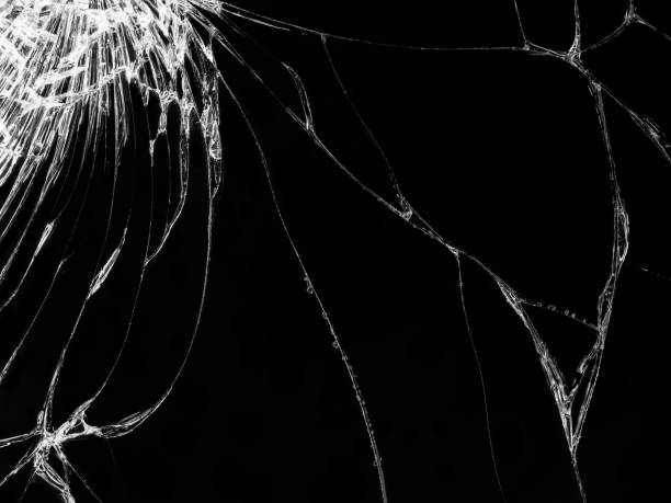 istock Cracked glass texture on black background 1130685488