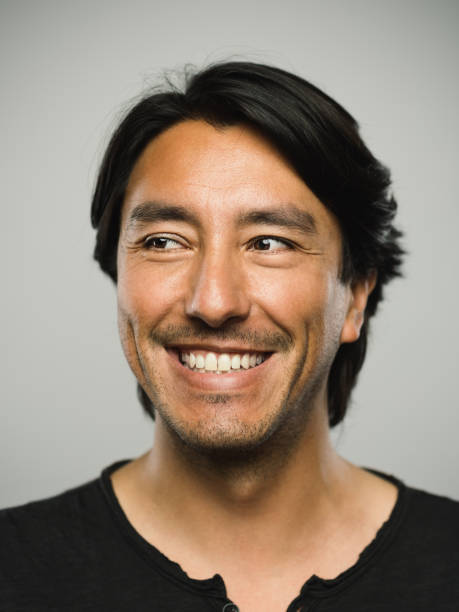 istock Portrait of real hispanic man with happy expression looking to the side 1130687716