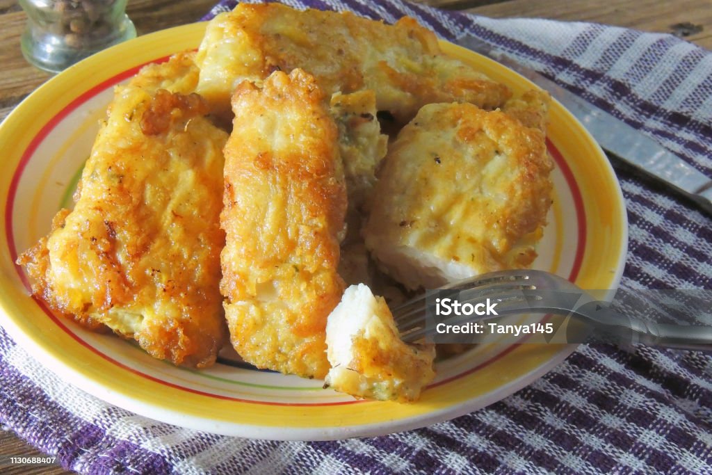 fried fish fillet Fried fish served with French fries and mixed vegetables Cod Stock Photo