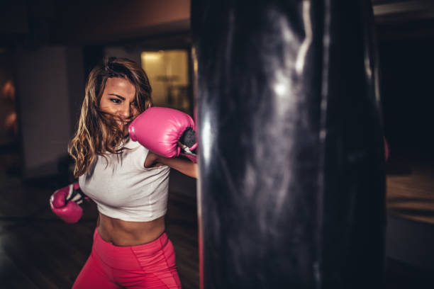 istock Beautiful woman boxer training 1130688981