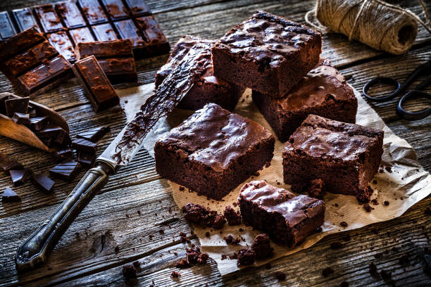 istock Homemade chocolate brownies shot on rustic wooden table 1130692144
