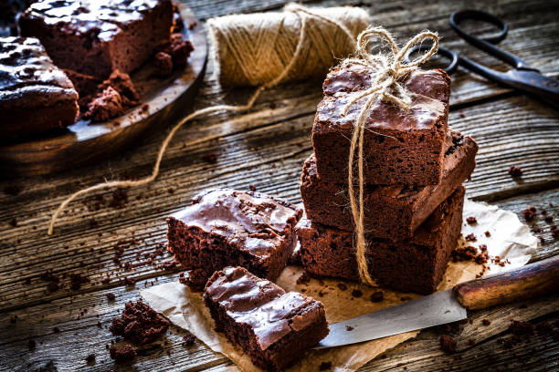 istock Homemade chocolate brownies shot on rustic wooden table 1130692145