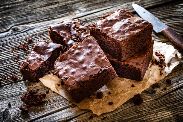istock Homemade chocolate brownies shot on rustic wooden table 1130692159