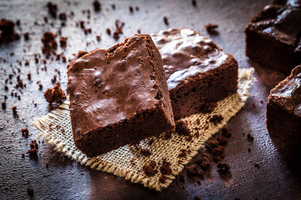 istock Homemade chocolate brownies shot on rustic wooden table 1130692236