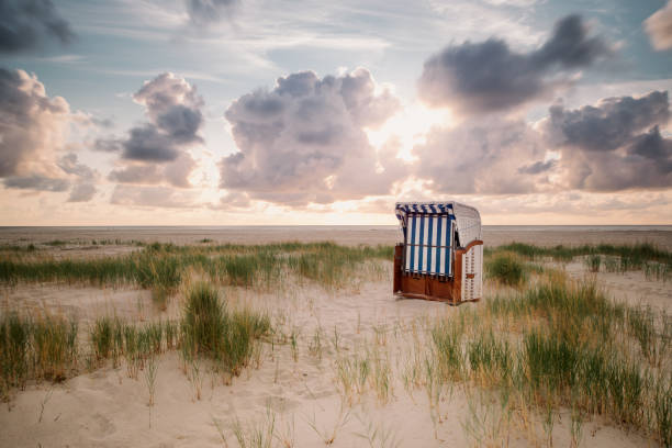 Beach chair Beach chair on the beach with a huge sky amrum stock pictures, royalty-free photos & images