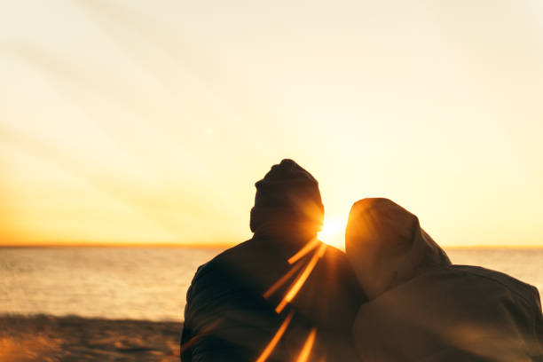 istock Couple admiring sea sunset. Spring 1130698699