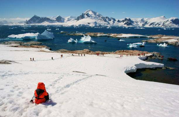 Woman hiking through ice and snow in Antarctica. Woman hiking through ice and snow in Antarctica. antartica stock pictures, royalty-free photos & images