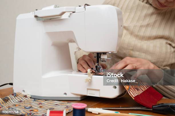 Woman To Operate The Sewing Machine Stock Photo - Download Image Now - 30-39 Years, Activity, Adult