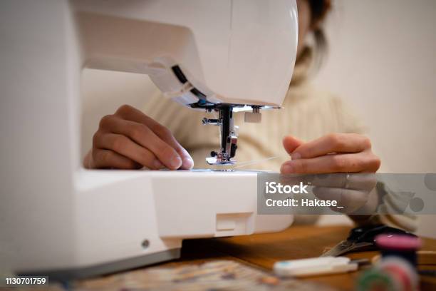 Woman To Operate The Sewing Machine Stock Photo - Download Image Now - 30-39 Years, Activity, Adult