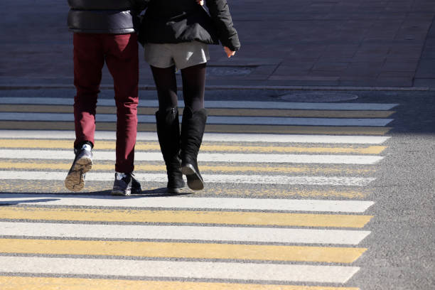 istock Couple walking on pedestrian crossing, rear view 1130701992