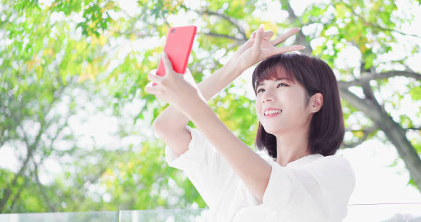 istock young woman take a selfie 1130705689