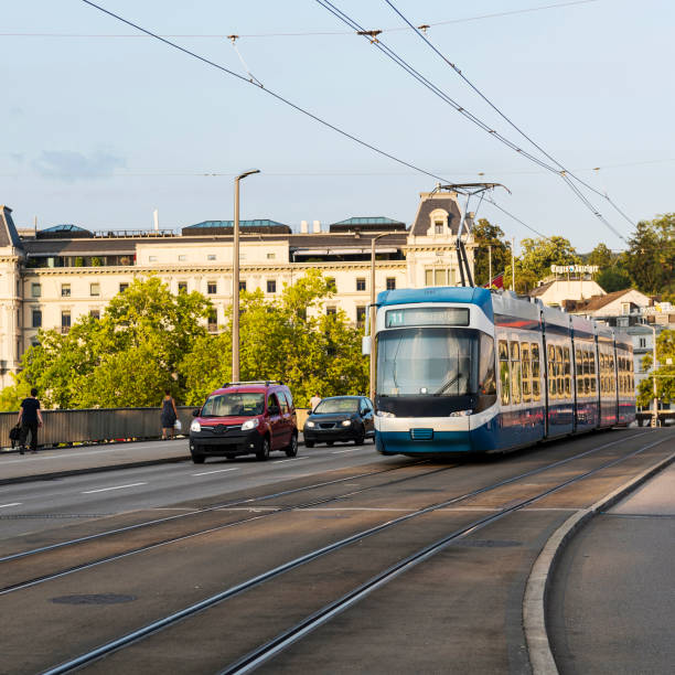 Tram passing the Bahnhofbruecke bridge in Zurich, Switzerland Zurich, Switzerland - August 19, 2018: Tram passing the Bahnhofbruecke bridge. Zurich is the largest city in Switzerland and the capital of the Canton of Zurich. zurich train station stock pictures, royalty-free photos & images