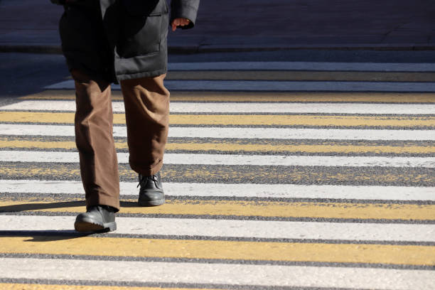 istock Man walking on pedestrian crossing, front view 1130705850