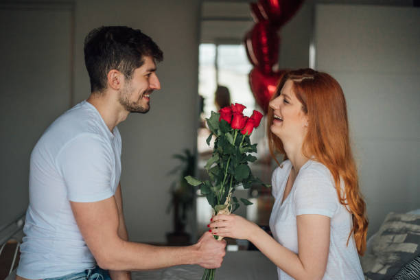 istock Woman receiving flowers 1130705938