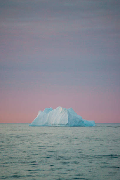 istock Floating Iceberg and Setting Sun in Antarctica 1130707669