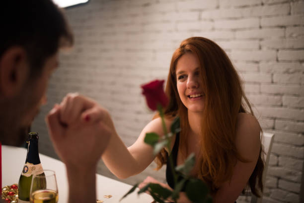 istock Couple in love holing hands over dinner 1130707755
