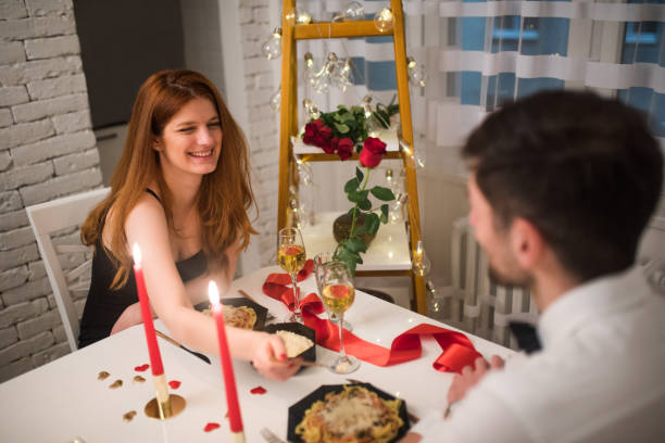 istock Romantic couple having a meal together 1130707773