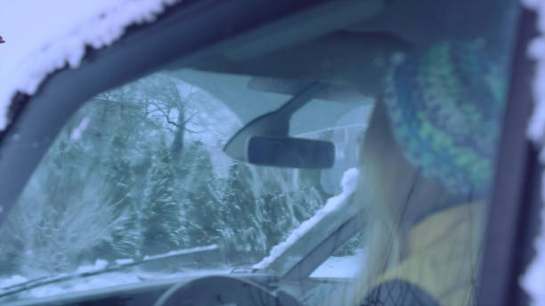 istock Female driver enjoying snow covered world 1130711363