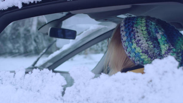 istock Female driver enjoying snow covered world 1130711434
