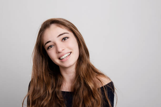 istock Young girl smiling portrait 1130712964
