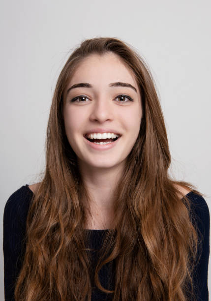 istock Young girl smiling portrait 1130713461