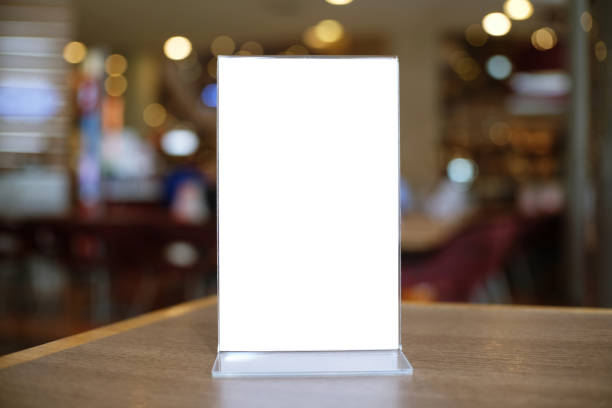 istock Menu frame standing on wood table in Bar restaurant cafe. space for text marketing promotion. 1130714032