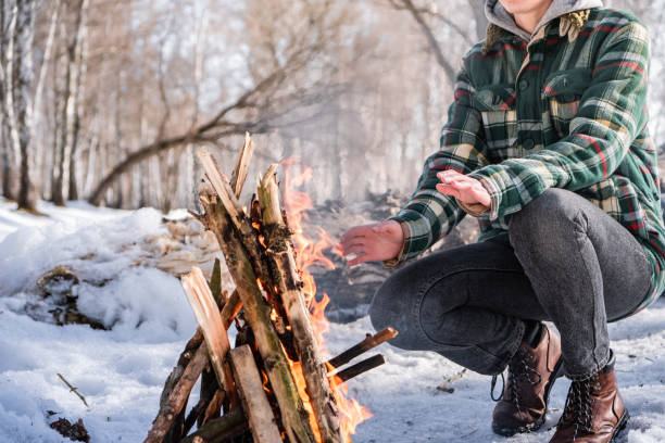 istock Basking near a campfire in a snowy birch forest 1130715553