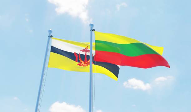 istock Lithuania and Brunei, two flags waving against blue sky 1130722575