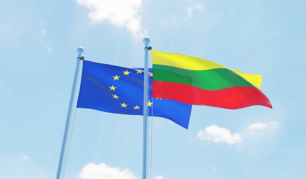 istock Lithuania and European Union, two flags waving against blue sky 1130722669