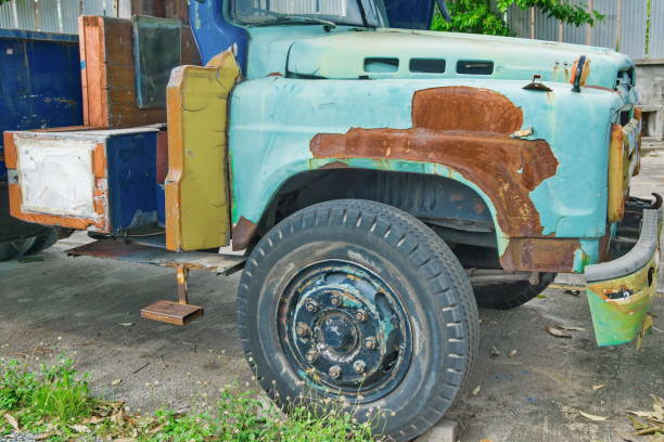 Rundu, Namibia - February 8, 2020: Remains of the orange truck Mercedes-Benz L at the roadside.