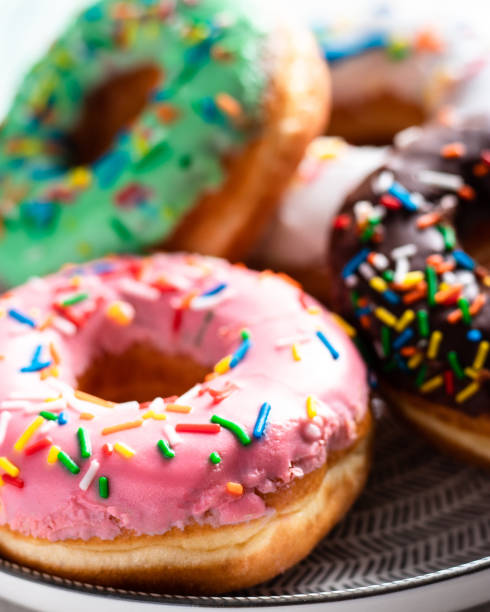 istock Front view of a group of sweet donuts, close up 1130723962