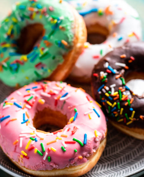 istock Front view of a group of sweet donuts, close up 1130724049