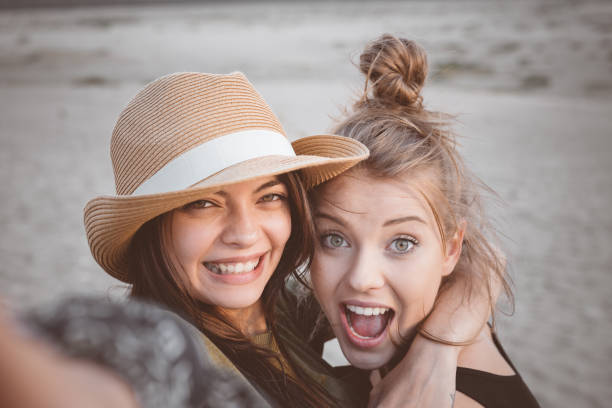 istock Cheerful young women embracing in desert 1130724408