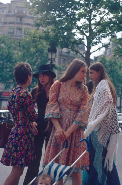 Young Parisian women on the Champ Elyseé Paris, Il de France, France, 1973. Young Parisian women on the Champ Elyseé. hippie photos stock pictures, royalty-free photos & images