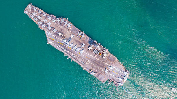 istock Top View Aircraft Carrier are sailing in the ocean 1130726433