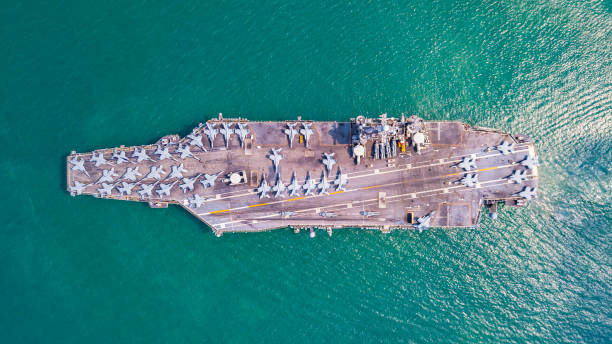 istock Top View Aircraft Carrier are sailing in the ocean 1130726436