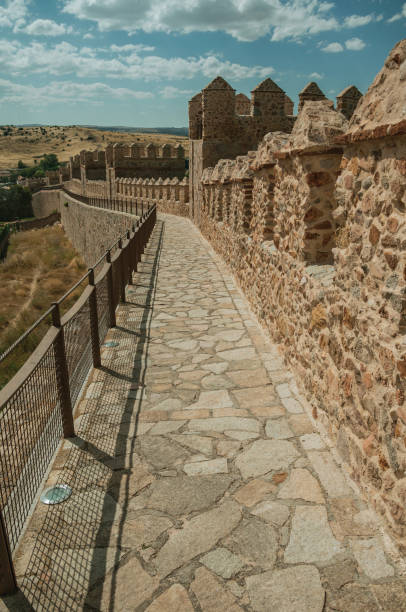 istock Pathway over old thick wall encircling the town of Avila 1130727506