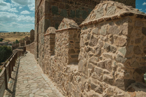 istock Pathway over old thick wall encircling the town of Avila 1130728941