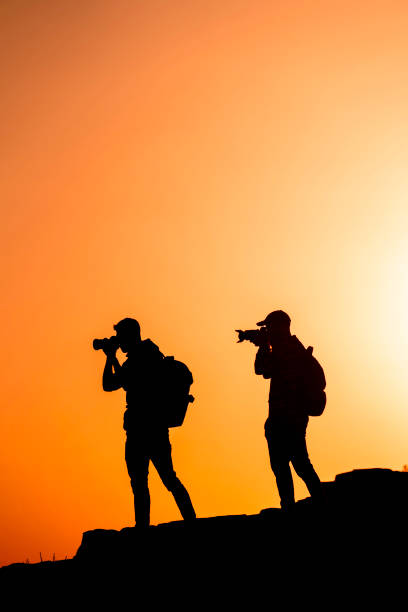 istock Photographers who shoots a sunset in the mountains 1130729297