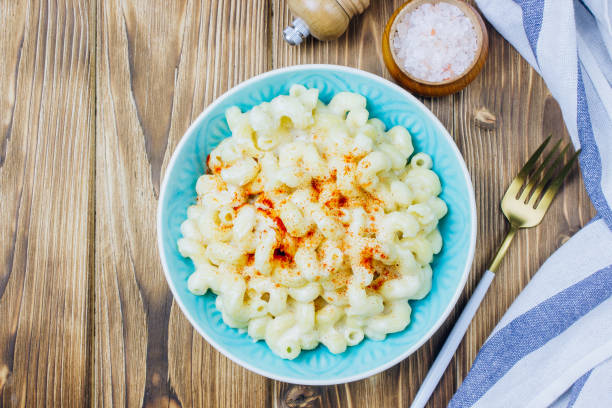 istock Mac and cheese, american style macaroni pasta with cheesy sauce 1130729516