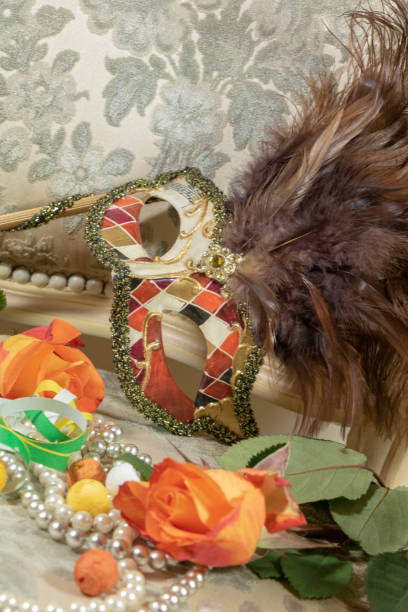 istock Harlequin's hand mask, carnival and Flowered Corso 1130730024