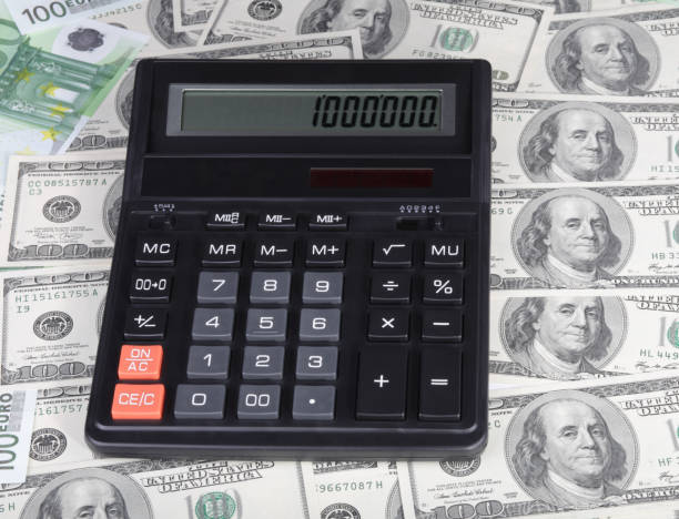 istock dollar, euro banknote and calculator 1130731314
