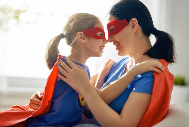 istock Girl and mom in Superhero costume 1130731663