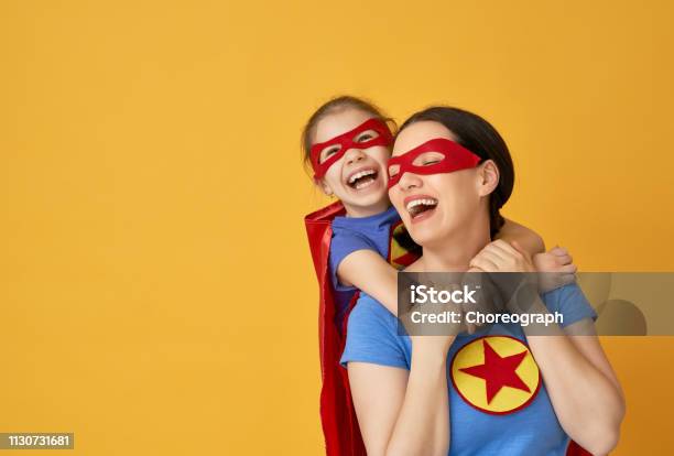 Girl And Mom In Superhero Costume Stock Photo - Download Image Now - Superhero, Mother, Child