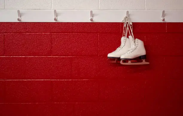 Skates hanging in locker room
