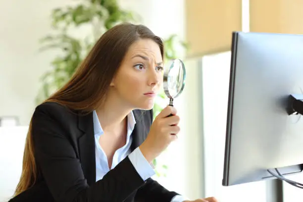 Suspicious office worker checking online content