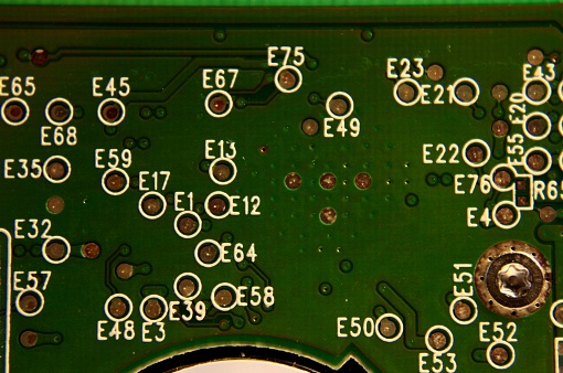Close up of a computer hard drive circuit board.