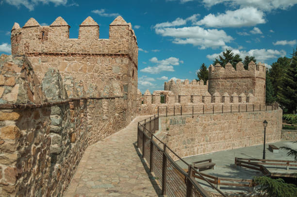 istock Pathway over old thick wall with large towers in Avila 1130739580