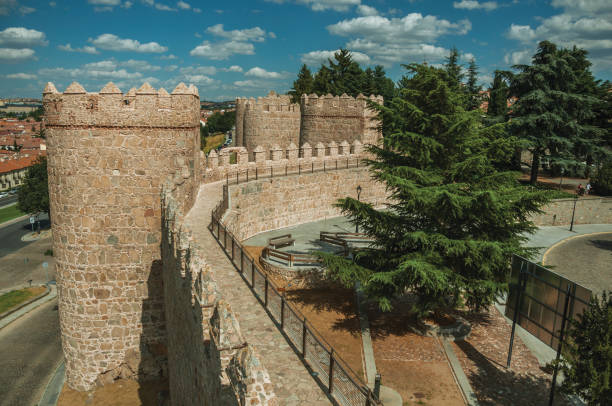 istock Pathway over old thick wall with large towers in Avila 1130741277