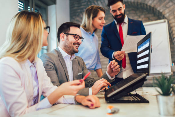 istock Business people working in office together. Team work in office. 1130743798